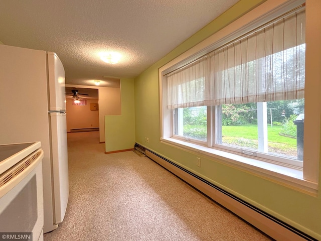 1277 Shakopee Ave E, Shakopee, MN 55379 - unfurnished room with a baseboard radiator, a textured ceiling, and ceiling fan