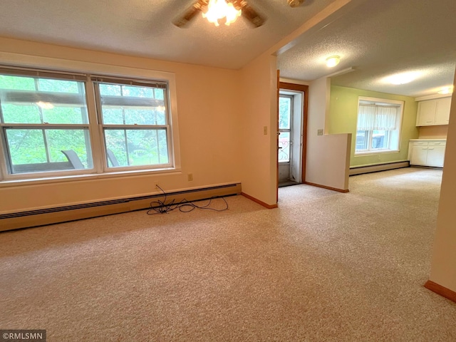 1277 Shakopee Ave E, Shakopee, MN 55379 - unfurnished room with baseboard heating, a textured ceiling, baseboards, ceiling fan, and light carpet
