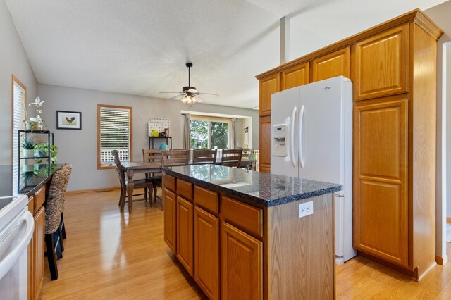 6445 Coryell Ct, Inver Grove Heights, MN 55076 - kitchen with white fridge with ice dispenser, light wood-style flooring, a ceiling fan, a center island, and stove