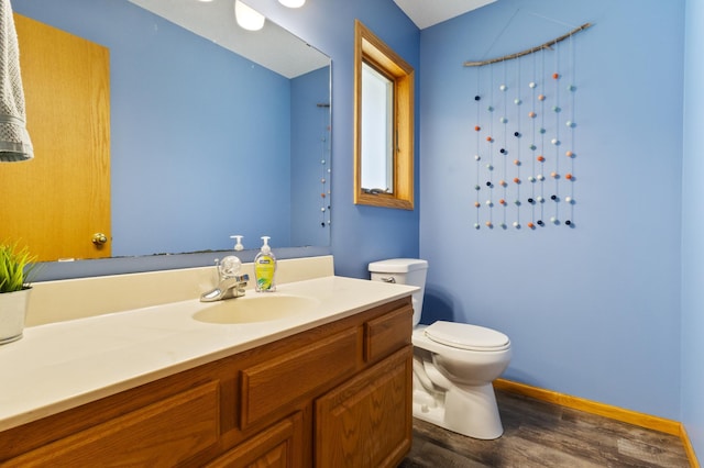 6445 Coryell Ct, Inver Grove Heights, MN 55076 - bathroom with vanity, wood finished floors, toilet, and baseboards