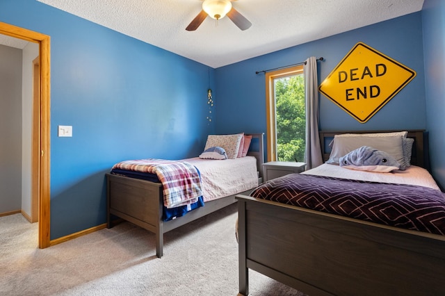 6445 Coryell Ct, Inver Grove Heights, MN 55076 - carpeted bedroom featuring a textured ceiling, baseboards, and a ceiling fan