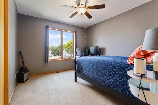 6445 Coryell Ct, Inver Grove Heights, MN 55076 - bedroom with light colored carpet, baseboards, a ceiling fan, and a textured ceiling