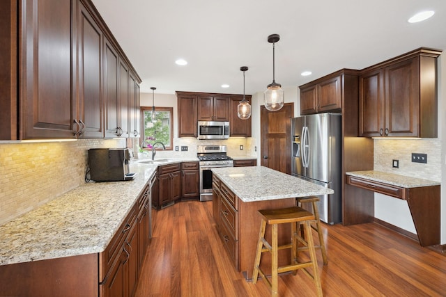 231 Winkler Trl, Cologne, MN 55322 - kitchen featuring stainless steel appliances, a sink, decorative backsplash, dark wood-style floors, and recessed lighting