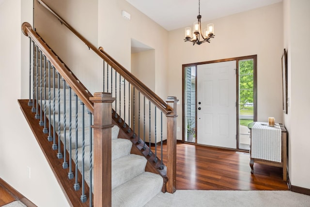 231 Winkler Trl, Cologne, MN 55322 - entryway with a chandelier, wood finished floors, and stairway