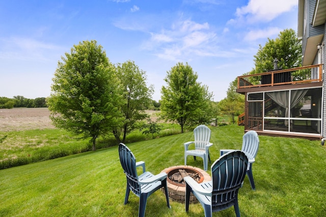 231 Winkler Trl, Cologne, MN 55322 - view of green lawn with a fire pit and a sunroom