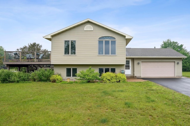 881 217th St, Osceola, WI 54020 - split level home featuring driveway, a front lawn, an attached garage, and a deck