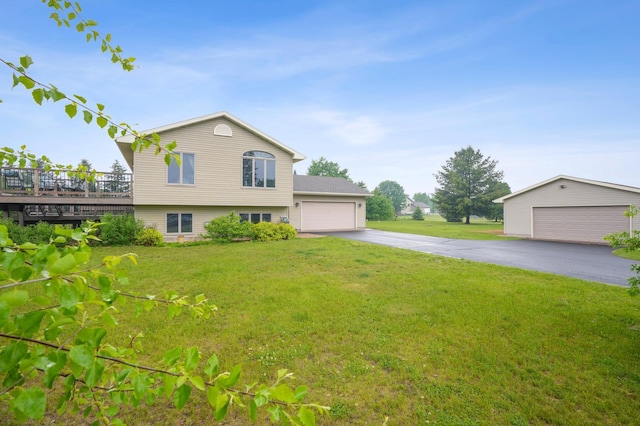 881 217th St, Osceola, WI 54020 - view of home's exterior with a yard, a deck, and an outbuilding