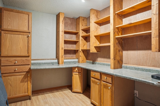 881 217th St, Osceola, WI 54020 - unfurnished office featuring light wood finished floors and a textured ceiling