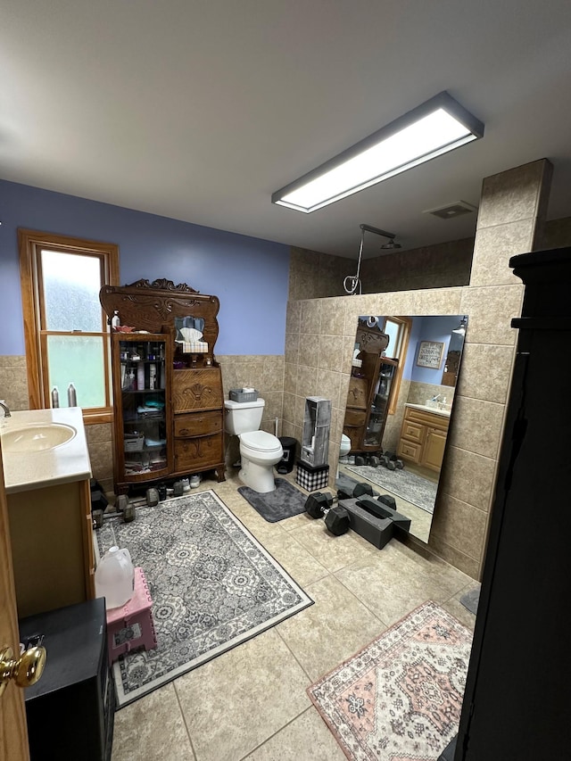 12283 County Road 31, Mount Vernon Twp, MN 55910 - full bath with tile walls, vanity, toilet, a tile shower, and tile patterned floors