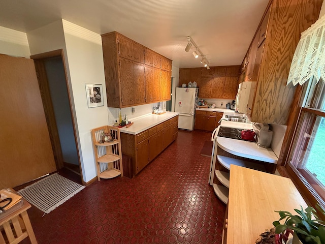 26813 Scenic Byway Rd, Faxon Twp, MN 56011 - kitchen with freestanding refrigerator, open shelves, light countertops, and brown cabinets