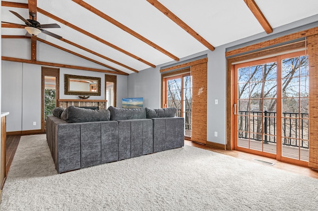 6230 Elm Ridge Cir, Corcoran, MN 55340 - living area featuring ceiling fan, a fireplace, baseboards, and carpet