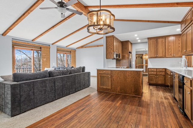 6230 Elm Ridge Cir, Corcoran, MN 55340 - kitchen with open floor plan, brown cabinetry, dark wood finished floors, a chandelier, and recessed lighting