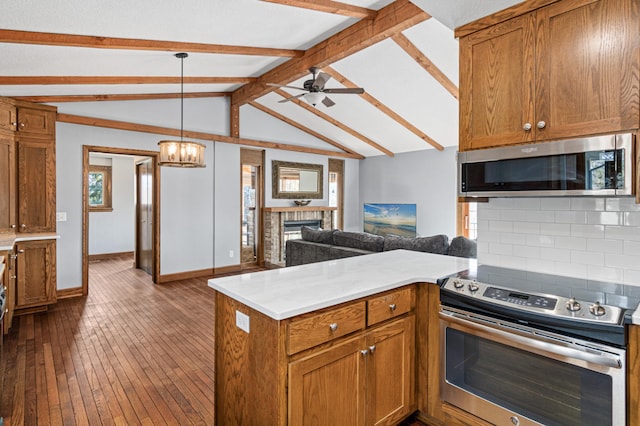 6230 Elm Ridge Cir, Corcoran, MN 55340 - kitchen with stainless steel appliances, a peninsula, open floor plan, decorative backsplash, and baseboards