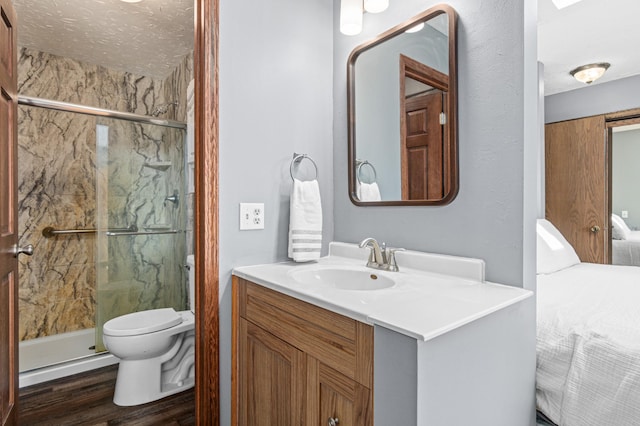 6230 Elm Ridge Cir, Corcoran, MN 55340 - bathroom featuring vanity, a marble finish shower, toilet, and wood finished floors
