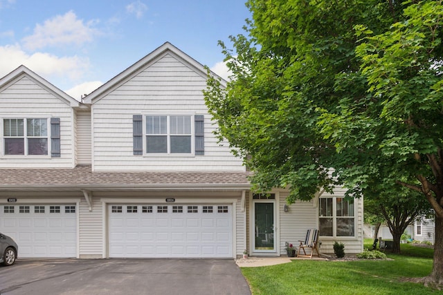 1924 Shamrock Pl, Chaska, MN 55318 - view of front of house with a garage, driveway, a front lawn, and a shingled roof