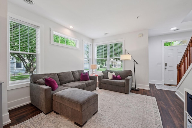1924 Shamrock Pl, Chaska, MN 55318 - living room with healthy amount of natural light, wood finished floors, stairs, and recessed lighting