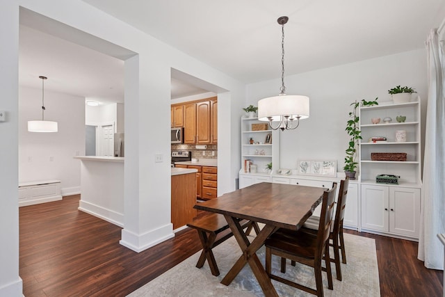 1924 Shamrock Pl, Chaska, MN 55318 - dining room with dark wood-style flooring and a chandelier