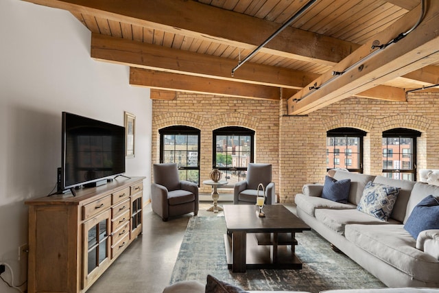 404 Washington Ave N Unit 504, Minneapolis, MN 55401 - living area with brick wall, wooden ceiling with exposed beams, finished concrete floors, and a baseboard radiator