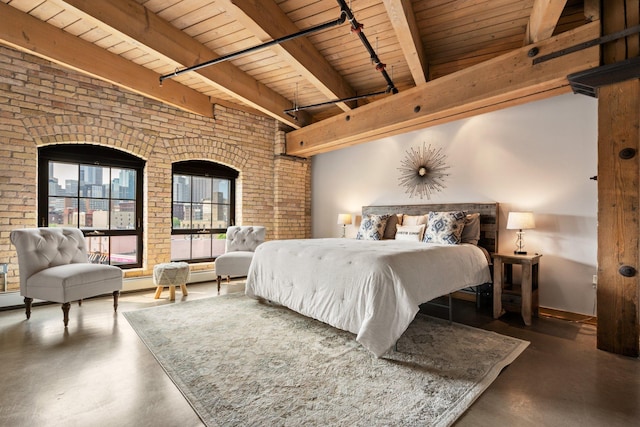 404 Washington Ave N Unit 504, Minneapolis, MN 55401 - bedroom featuring wood ceiling with exposed beams, brick wall, concrete floors, track lighting, and baseboards