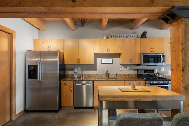 404 Washington Ave N Unit 504, Minneapolis, MN 55401 - kitchen with appliances with stainless steel finishes, a sink, concrete floors, dark stone counters, and beamed ceiling
