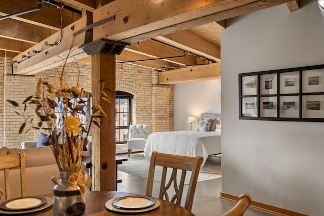 404 Washington Ave N Unit 504, Minneapolis, MN 55401 - dining area featuring brick wall, finished concrete flooring, and baseboards