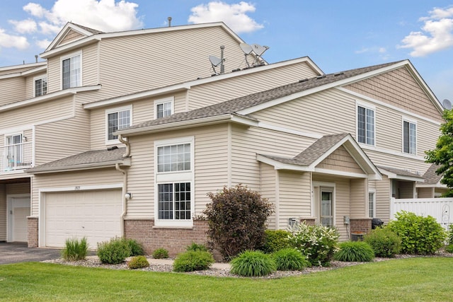 17829 66th Ave N, Maple Grove, MN 55311 - view of front of home featuring a garage, asphalt driveway, and brick siding