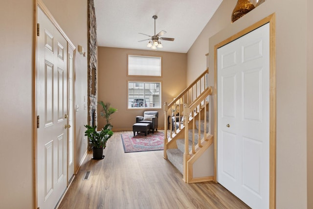 17829 66th Ave N, Maple Grove, MN 55311 - entryway with stairway, wood finished floors, and ceiling fan