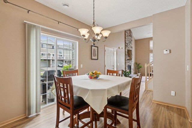17829 66th Ave N, Maple Grove, MN 55311 - dining room with a chandelier and light wood-style floors