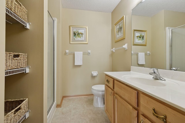 17829 66th Ave N, Maple Grove, MN 55311 - full bathroom featuring vanity, a shower stall, a textured ceiling, and tile patterned floors