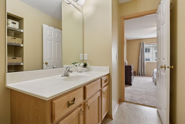 17829 66th Ave N, Maple Grove, MN 55311 - bathroom with a textured ceiling, vanity, and tile patterned flooring
