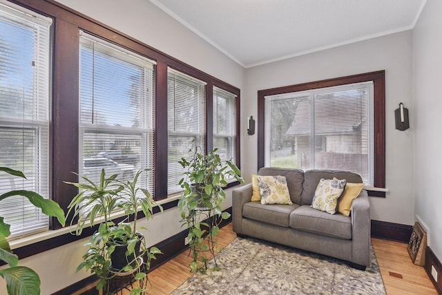 3314 Aldrich Ave N, Minneapolis, MN 55412 - sunroom with wood finished floors, crown molding, and baseboards