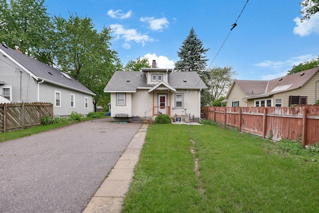 3314 Aldrich Ave N, Minneapolis, MN 55412 - bungalow-style home with a chimney, stucco siding, and roof with shingles