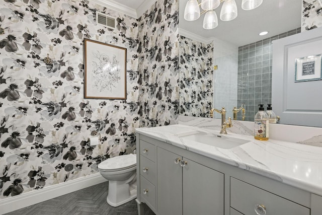 9320 Abigail Ct, Inver Grove Heights, MN 55077 - bathroom with wallpapered walls, ornamental molding, toilet, vanity, and baseboards