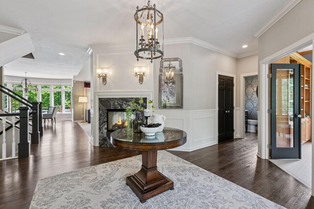 9320 Abigail Ct, Inver Grove Heights, MN 55077 - entrance foyer featuring wood finished floors, crown molding, a chandelier, recessed lighting, and a premium fireplace