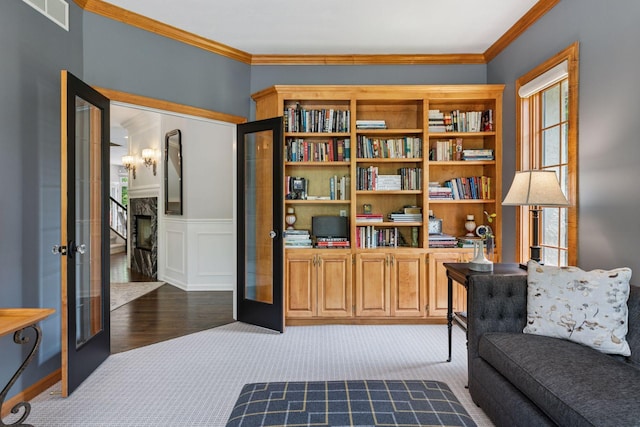 9320 Abigail Ct, Inver Grove Heights, MN 55077 - sitting room featuring crown molding, dark carpet, french doors, wainscoting, and a chandelier