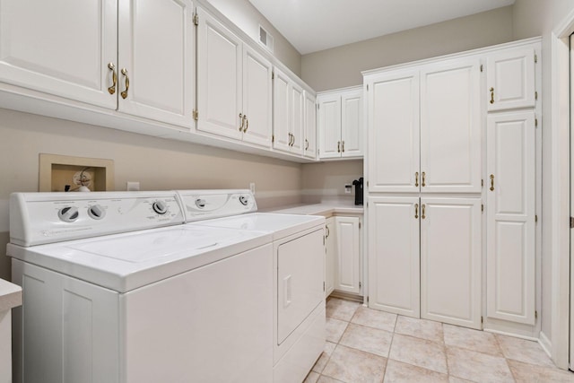 9320 Abigail Ct, Inver Grove Heights, MN 55077 - laundry room featuring cabinet space, independent washer and dryer, and light tile patterned floors