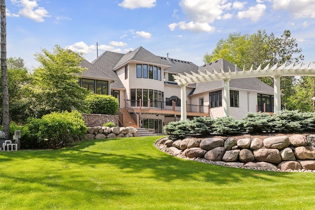 9320 Abigail Ct, Inver Grove Heights, MN 55077 - back of property with stucco siding, a pergola, stairs, a lawn, and a sunroom