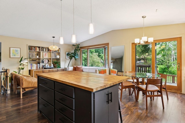 164 Wendy Ct, Shoreview, MN 55126 - kitchen with dark cabinetry, butcher block countertops, dark wood-style flooring, vaulted ceiling, and hanging light fixtures