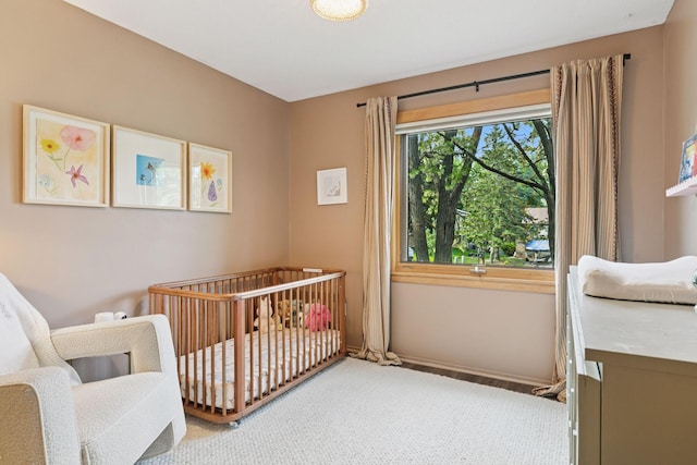 164 Wendy Ct, Shoreview, MN 55126 - bedroom with a nursery area, baseboards, and carpet flooring