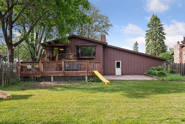164 Wendy Ct, Shoreview, MN 55126 - rear view of house with a patio, a deck, a chimney, and board and batten siding