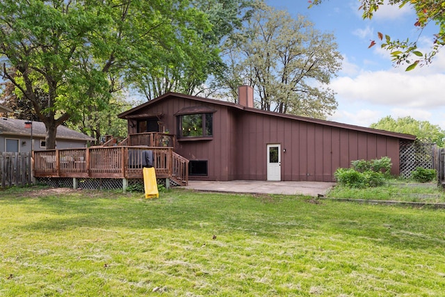 164 Wendy Ct, Shoreview, MN 55126 - rear view of house featuring a chimney, a patio area, a wooden deck, and board and batten siding