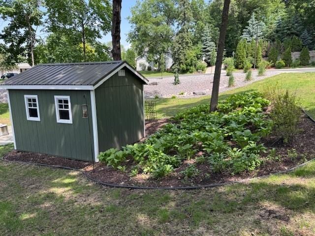 706 Pershing Ave N, New Prague, MN 56071 - view of shed featuring view of wooded area