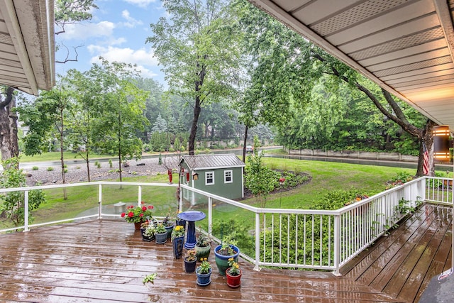 706 Pershing Ave N, New Prague, MN 56071 - wooden terrace with a lawn and an outdoor structure