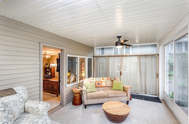 706 Pershing Ave N, New Prague, MN 56071 - sunroom with plenty of natural light, wood walls, and ceiling fan