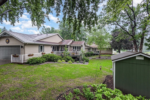 706 Pershing Ave N, New Prague, MN 56071 - view of grassy yard featuring a garage
