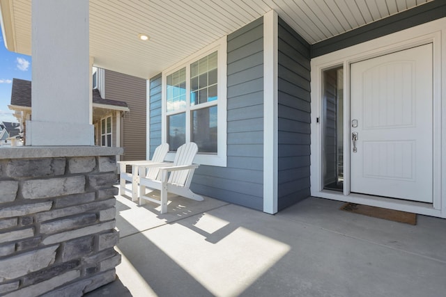 12946 Jewell Cir, Blaine, MN 55449 - property entrance with a porch