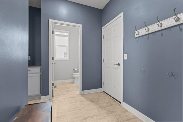12946 Jewell Cir, Blaine, MN 55449 - hallway with light wood-style flooring and baseboards
