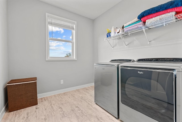 12946 Jewell Cir, Blaine, MN 55449 - washroom featuring washer and clothes dryer and baseboards