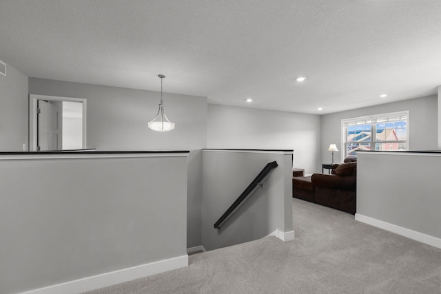 12946 Jewell Cir, Blaine, MN 55449 - corridor featuring an upstairs landing, carpet, baseboards, recessed lighting, and a textured ceiling