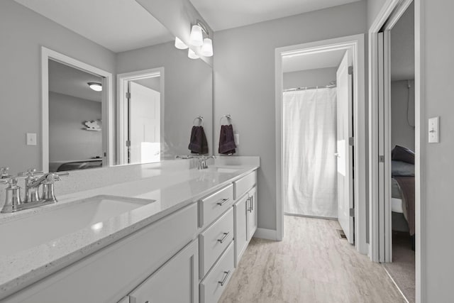 12946 Jewell Cir, Blaine, MN 55449 - full bath featuring double vanity, baseboards, and a shower with shower curtain
